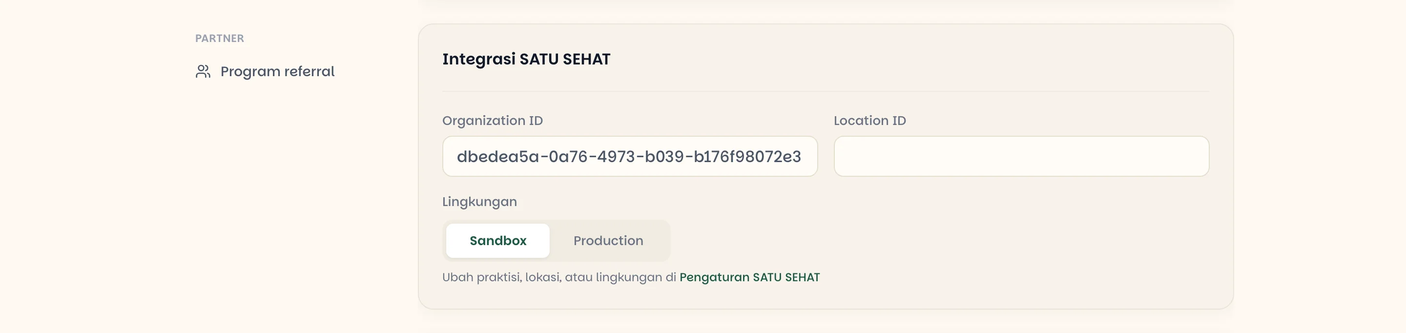 Bagian Integrasi SATU SEHAT pada pengaturan klinik berisi Organization ID, Location ID, dan pilihan lingkungan Sandbox atau Production